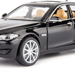 Black BMW model car on a white background