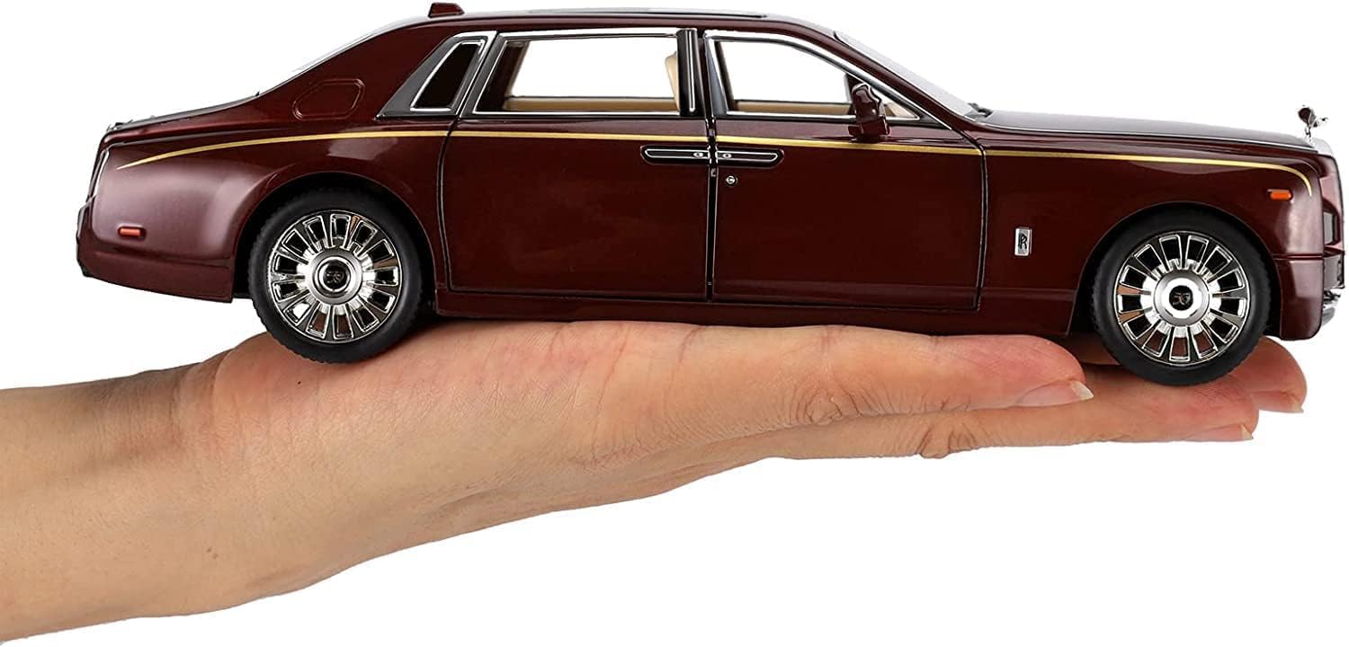Model of a luxury car held in a hand against a white background