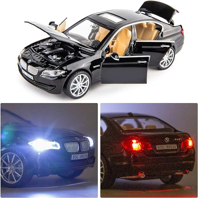 Black toy car with open doors and hood, illuminated headlights and taillights on a white background.