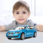 Child with a blue toy car on a light background